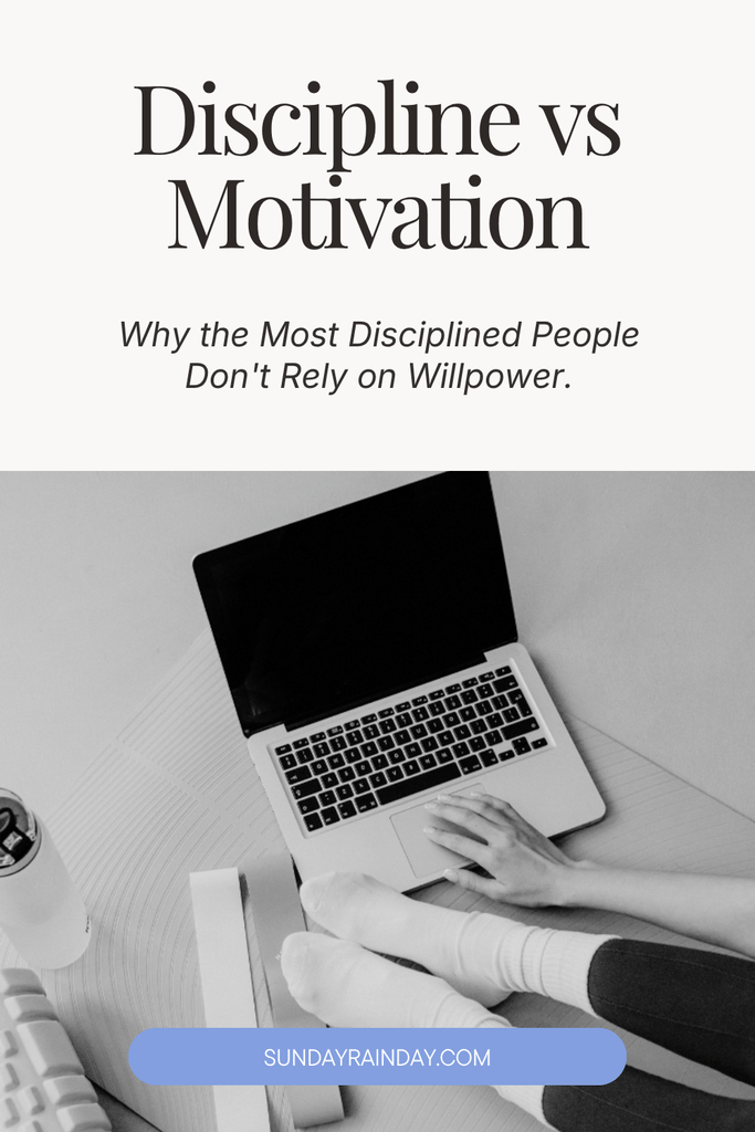Black-and-white photo of a person in white socks sitting on a yoga mat, typing on a laptop beside a water bottle, under the title “Discipline vs Motivation: Why the Most Disciplined People Don’t Rely on Willpower”.